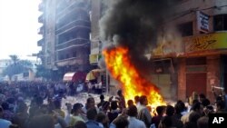 Protesters storm an office of Egyptian President Mohammed Morsi's Muslim Brotherhood Freedom and Justice party and set fires in the Mediterranean port city of Alexandria, Egypt, Nov. 23, 2012.