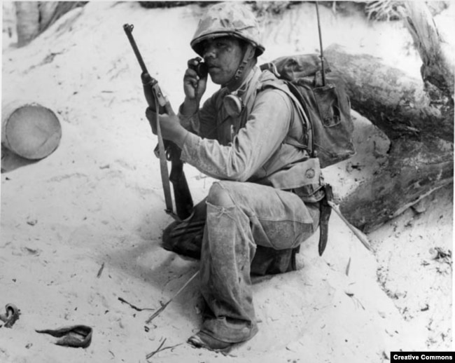 A Navajo Code Talker relays a message on a field radio. The code talkers served in the South Pacific during World War II and were kept a secret until 1968 when the code was finally declassified.