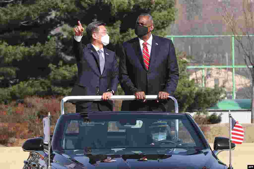 U.S. Secretary of Defense Lloyd Austin, right, talks with South Korean Defence Minister Suh Wook as they inspect honor guards during a welcoming ceremony at the Defence Ministry in Seoul.