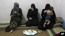 Syrian women refugees, who fled the violence in Syria, at their temporary home at the Al Hussein Palestinian refugees camp in Amman, Jordan, March 7, 2012