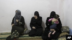 Syrian women refugees, who fled the violence in Syria, at their temporary home at the Al Hussein Palestinian refugees camp in Amman, Jordan, March 7, 2012