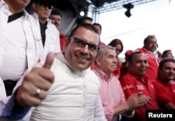 Manuel Baldizon gestures during a political rally in Mixco, on the outskirts of Guatemala City, Aug. 30, 2015.