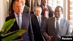 Zimbabwean President Emmerson Mnangagwa walks with Russian Foreign Minister Sergey Lavrov before their meeting in Harare, Zimbabwe, March 8, 2018. 