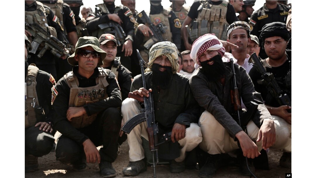 Soldiers from the 1st Battalion of the Iraqi Special Operations Forces wear fake beards during a training exercise to prepare for the operation to retake Mosul from IS, in Baghdad, Iraq, Sept. 2016