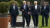 Head of the Iranian Atomic Energy Organization, Ali Akbar Salehi, second from left, and Iranian Foreign Minister Javad Zarif, second from right, walk together during negotiations at a hotel in Lausanne, Switzerland, March 29, 2015. 