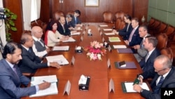 In this Press Information Department photo, Pakistan's adviser on foreign affairs, Sartaj Aziz, third from left, talks with Richard Olson, third from right, U.S. special representative for Afghanistan and Pakistan, in Islamabad, June 10, 2016.