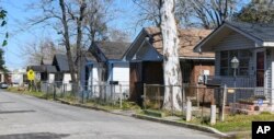 FILE - Homes line Richardson Drive in Africatown in Mobile, Ala., Jan. 29, 2019. Established by the last boatload of Africans abducted into slavery and shipped to the United States just before the Civil War, the coastal Alabama community now shows scarcely a trace of its founders.