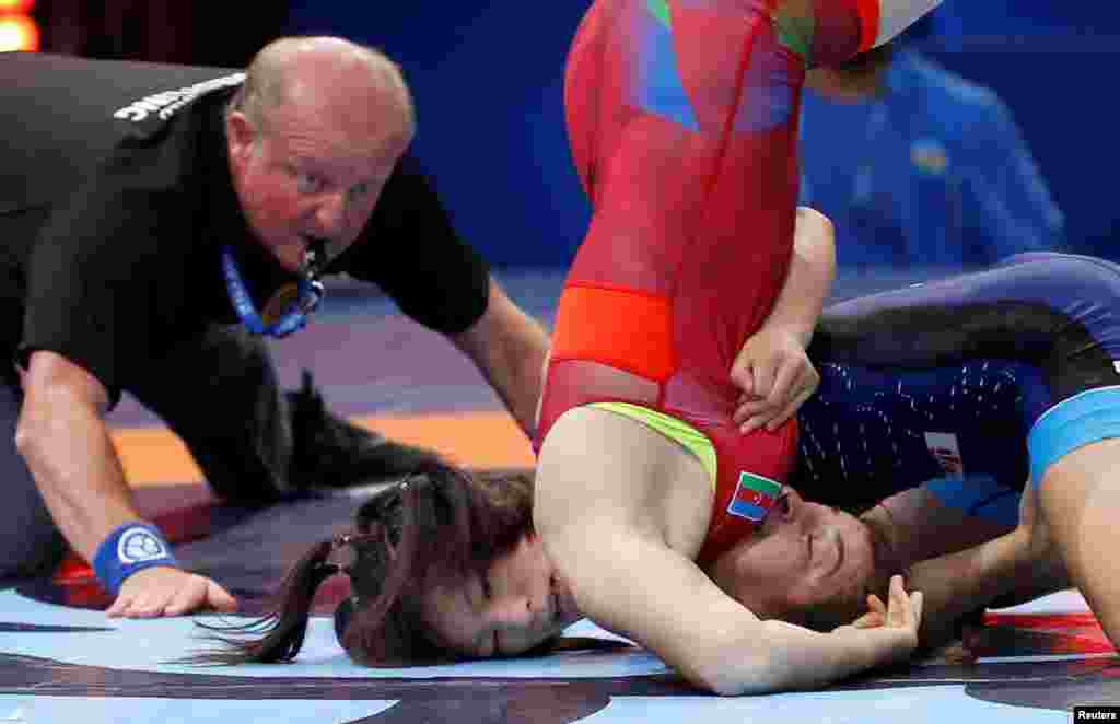 Yukako Kawai of Japan competes against Elmira Gambarova of Azerbaijan in the women&#39;s Wrestling 63kg category final of the FILA World Wrestling Championships in Paris, France.