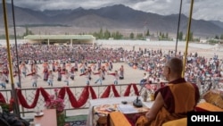 The Dalai Lama watching the performances at the TCV Choglamsar football ground in Ladakh