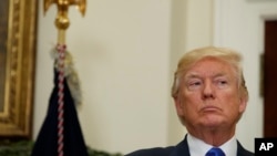 President Donald Trump listens in the Roosevelt Room of the White House in Washington, Aug. 2, 2017, during an event to unveil legislation that would place new limits on legal immigration. 