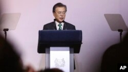 FILE - South Korea's President Moon Jae-in delivers his speech entitled "ROK and ASEAN: Partners for Achieving Peace and Co-prosperity in East Asia" during the 42nd Singapore Lecture organized by the Institute of South East Asian Studies (ISEAS) in Singapore.