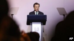 South Korea's President Moon Jae-in delivers his speech entitled "ROK and ASEAN: Partners for Achieving Peace and Co-prosperity in East Asia" during the 42nd Singapore Lecture organized by the Institute of South East Asian Studies (ISEAS) in Singapore, July 13, 2018. 