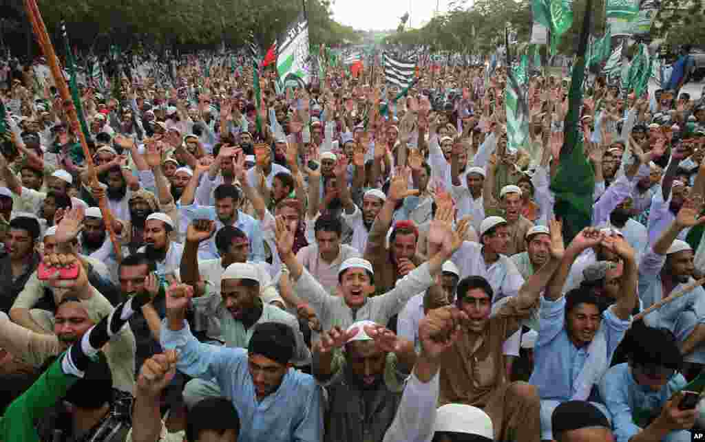 Supporters of religious parties rally to support the Saudi Arabian government in Karachi, Pakistan. Pakistani parliamentarians agreed to support Saudi Arabia in case of any threat to its territorial integrity. However, the legislators were not in favor of sending troops to Yemen to fight the Shiite rebels, known as Houthis, officials said.