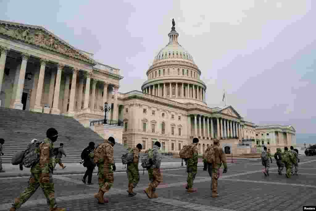 Members of the National Guard arrive to the U.S. Capitol days after a violent mob stormed the Capitol in Washington, D.C.
