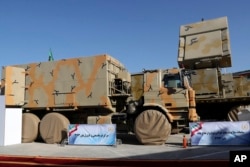 In this photo released by the official website of the office of the Iranian Presidency, a part of Iran-made Bavar-373 air-defense missile system is seen in a ceremony to unveil by President Hassan Rouhani, Iran, Thursday, Aug. 22, 2019. (Iranian Presidency Office via AP)