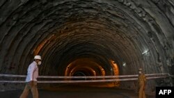 A policeman stands guard at the Zojila tunnel under construction which connects Srinagar, Kashmir, to the Indian union territory of Ladakh bordering China.