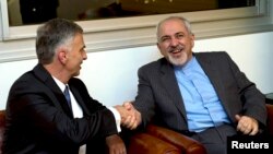 Iranian Foreign Minister Mohammad Javad Zarif reacts as he talks with reporters before meeting with U.S. Secretary of State John Kerry saying that his meeting with Kerry is important to see if progress could be made in narrowing differences on his country&#39;s disputed nuclear program, in Geneva, Jan. 14, 2015.