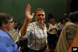 FILE - Miguel Angel Yunes waves at supporters as he arrives to a news conference in Veracruz, Mexico, on June 5, 2016. Hobbled by corruption scandals, violence and a weak economy, the ruling Institutional Revolutionary Party lost four states including Veracruz.