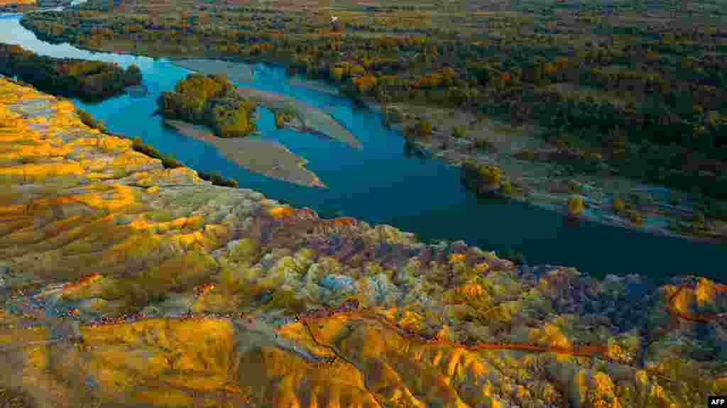 This aerial photo taken on August 23, 2018 shows a view of Wucaitan, also known as Rainbow Beach, in Burqin county in China's northwestern Xinjiang region.