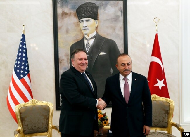 U.S. Secretary of State Mike Pompeo, left, meets with Turkish Foreign Minister Mevlut Cavusoglu in Ankara, Oct. 17, 2018.