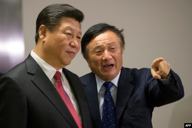 FILE - Chinese President Xi Jinping, left, is shown around the offices of Chinese tech firm Huawei technologies by its President Ren Zhengfei in London during his state visit, Oct. 21, 2015.