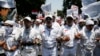 Members of hardline Islamic groups, including the Islamic Defenders Front, protest to show their displeasure over incoming Jakarta governor Basuki Tjahaja Purnama, who is an ethnic Chinese Christian, in Jakarta, Sept. 24, 2014.