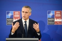 FILE - NATO Secretary General Jens Stoltenberg addresses a press conference in Riga, Latvia, Nov. 30, 2021.