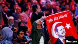 Supporters of Turkish President Tayyip Erdogan wait for his arrival for AK Party's Istanbul congress, Turkey, May 6, 2018. 