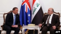 A handout picture released by Iraq's Prime Minister's office shows Iraqi Prime Minister Haider al-Abadi (R) and his Australian counterpart Tony Abbott meeting in Baghdad, Jan. 4, 2015.