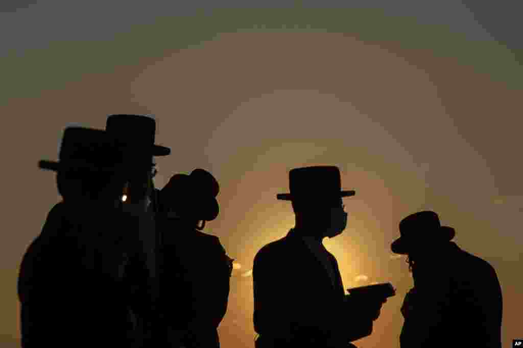 Ultra-Orthodox Jews of the Kiryat Sanz Hassidic sect pray on a hill overlooking the Mediterranean Sea in a Tashlich ceremony during a nationwide three-week lockdown to curb the spread of the coronavirus in Netanya, Israel.