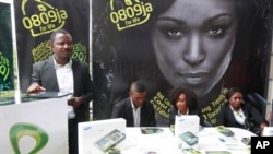 FILE - Staff of Etisalat Nigeria await customers during launch of mobile number portability in Lagos, the commercial capital of a nation that was poised to overtake South Africa as the biggest economy on the continent in 2013.