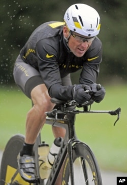 An October 7, 2012 photo of Lance Armstrong competing in Nike gear in the Rev3 Half Full triathalon in Ellicott City, Md.