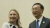 U.S. Secretary of State Hillary Rodham Clinton, left, and Chinese Foreign Minister Yang Jiechi pose for photos before their meeting on the sideline of the ASEAN regional forum in Phnom Penh, July 12, 2012.