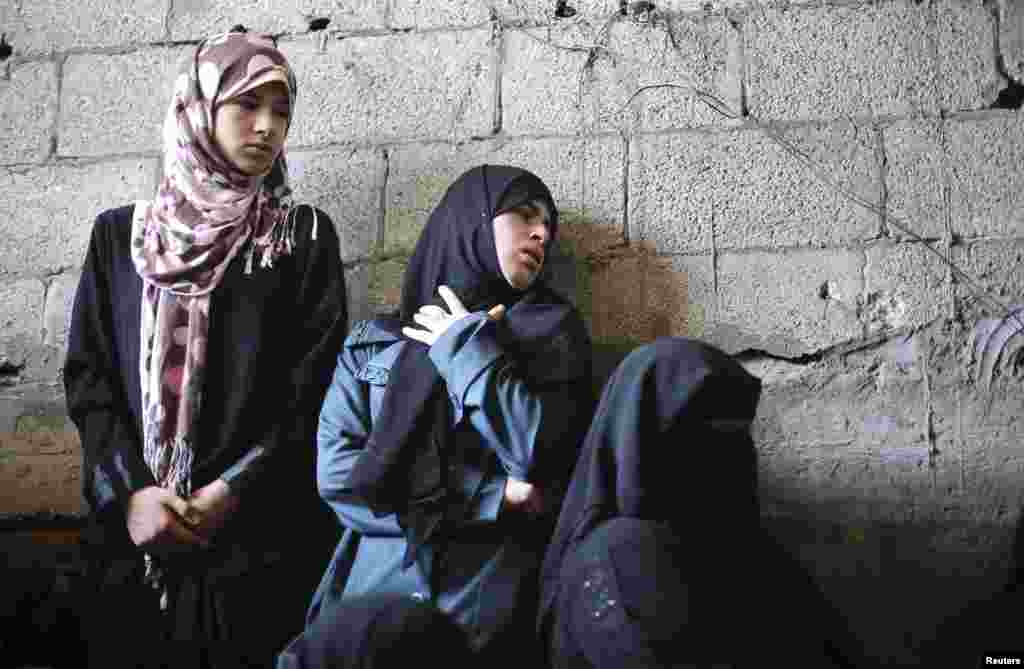 Palestinian relatives of Tawfiq al-Aga, who medics said was killed in Israeli shelling, mourn during his funeral in Khan Younis in the southern Gaza Strip.