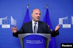 European Economic and Financial Affairs Commissioner Pierre Moscovici speaks during a news conference in Brussels, Belgium Aug. 20, 2018.