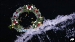 A wreath floats after being thrown into the sea during a service of remembrance aboard the Titanic Memorial Cruise, over the Titanic disaster site 100 years after it sank in the western Atlantic Ocean April 15, 2012.