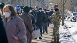 People wait in line to get vaccinated at a mass COVID-19 vaccination site in the Queens borough of New York, Wednesday, Feb. 24, 2021. (AP)