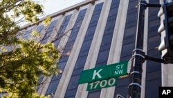 FILE - Known as a center for lobbyists, lawyers, and think tanks, the K Street corridor is seen in northwest Washington, May 3, 2018. In political discourse, "K Street" has become synonymous with the effort by high-power advocacy groups to influence Congress and government decision making. 