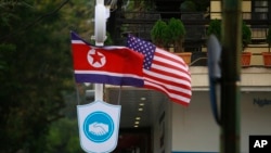 FILE - Flags of North Korea and the U.S are flown on a street in Hanoi, Vietnam, Feb. 19, 2019.