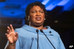 FILE -Georgia Democratic gubernatorial candidate Stacey Abrams addresses supporters during an election night watch party in Atlanta, Nov. 6, 2018.