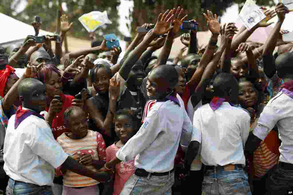 People cheer at Pope Francis upon his arrival in Bangui.