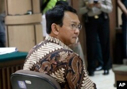 Jakarta Governor Basuki Tjahaja Purnama, popularly known as "Ahok", sits on the defendant's chair during his trial at the North Jakarta District Court in Jakarta, Indonesia, Dec. 13, 2016.