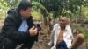 VOA Khmer reporter Sok Khemara​ interviews Ao An in Battambang province's Kamrieng district in mid-December 15, 2019. (Hul Reaksmey/VOA Khmer) ​​ 