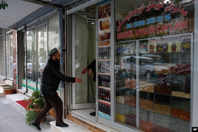 A man enters a shop in the Uighur immigrant neighborhood of Zeytinburnu, Turkey, Dec. 14, 2017.