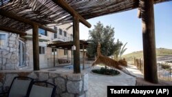 Airbnb Israel - a cat jumps at a guest house advertised on Airbnb international home-sharing site in Nofei Prat settlement at the West Bank.