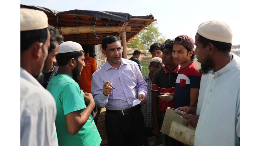 FILE - Rohingya Muslim leader Mohib Ullah speaks to other Rohingya people in Cox's Bazar, Bangladesh, April 7, 2019.