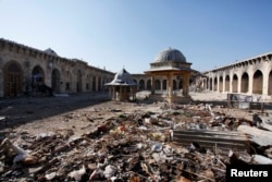 A general view of damage in the Umayyad mosque of Old Aleppo, Syria, Dec. 15, 2013.