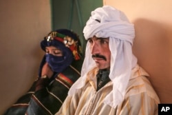 A couple wait to legalize their marriage during the annual festival of Imilchil, in a small village in the Atlas mountains in Morocco, Sept. 22, 2017.