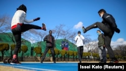 Athletes from South Sudan, Lucia Moris, Akoon Akoon and Michael Machiek, take part in their training session with Japanese trainers on Jan. 29, 2021, in preparation for the Tokyo 2020 Olympic Games. (REUTERS/Issei Kato)