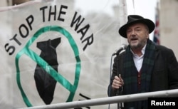 Anti-war activist and former British member of parliament George Galloway speaks at a rally against taking military action against Islamic State in Syria, outside Downing Street in London, Nov. 28, 2015.